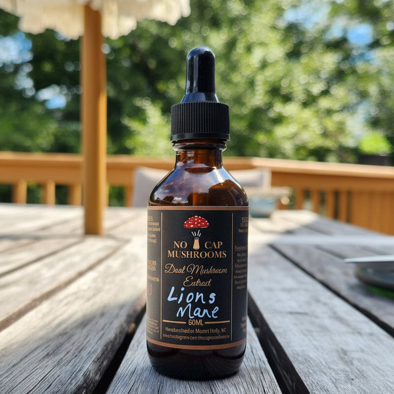 Bottle of 'Lions Mane' mushroom extract on a wooden surface with blurred greenery in the background
