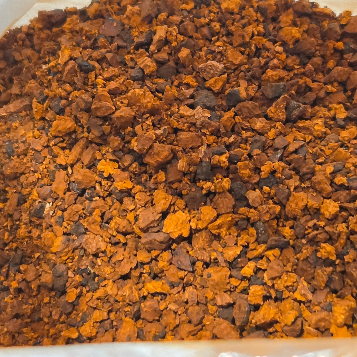 A close up picture of ground Chaga mushrooms